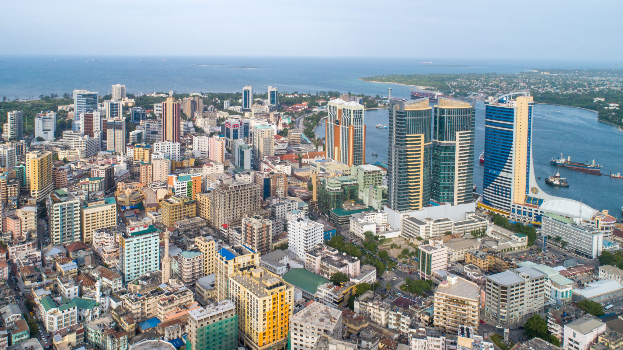 A breathtaking aerial drone shot of Dar Es Salaam, capturing the city's vibrant skyline, bustling streets, and coastal beauty. Perfect for travel, urban, and technology themes